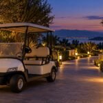 Generic parked cart beside a softly lit private walkway at twilight